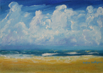 Clouds over teal ocean